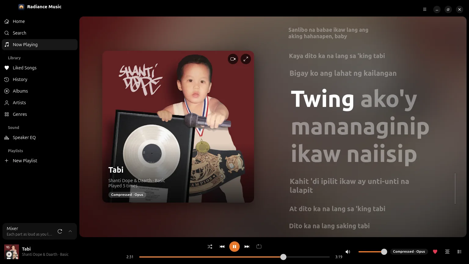 Now Playing on a computer, the lyrics lit word by word beside the cover